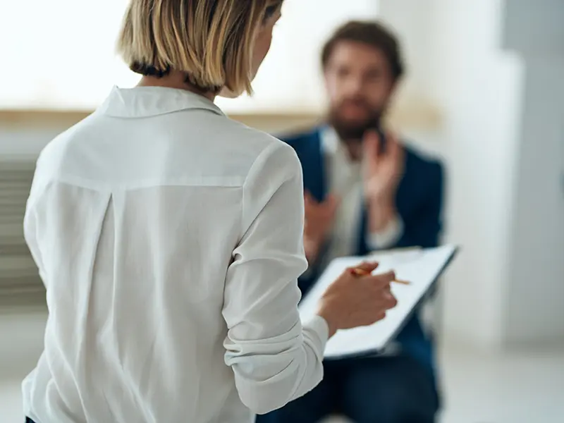 woman holding paperwork